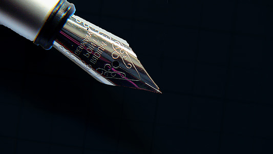 silver fountain pen on black background thumbnail