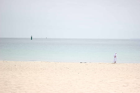 person standing on seashore thumbnail