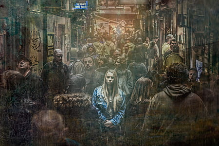 woman wearing blue denim jacket in a crowd of people thumbnail