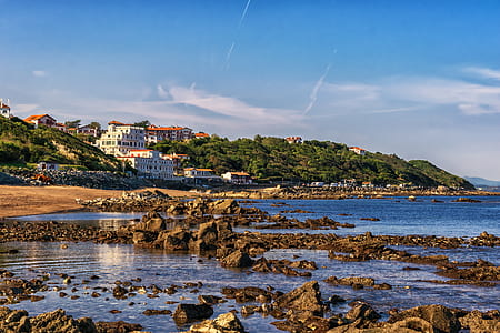 landscape photo of seashore and mountains thumbnail