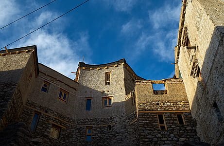 gray concrete building under blue sky thumbnail