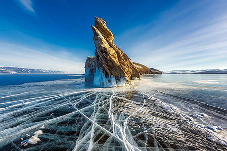 rock formation surrounded by water thumbnail