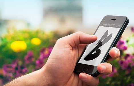 selective focus of person using space gray iPhone 5s thumbnail