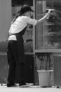 grayscale photography of woman cleaning window thumbnail