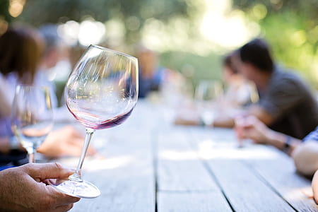 person holding clear champagne glass during daytime thumbnail