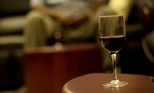 rule of thirds photography of clear wine glass on brown wooden table thumbnail