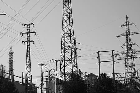 black electrical towers at daytime thumbnail