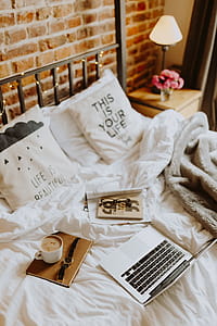 Morning coffee in bed. Working in bed thumbnail