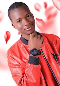 smiling man wearing red and black zip-up jacket thumbnail