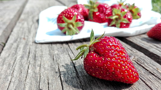 strawberries on wood surface thumbnail