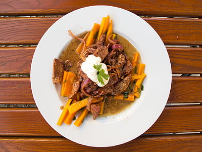 carrots with meat toppings and sauce on plate thumbnail