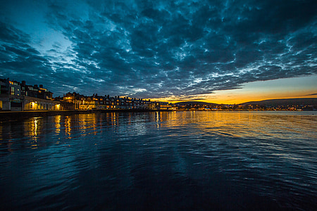 beach shore and blue sky photography during night time thumbnail