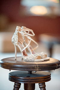 Pair of Silver Leather Open-toe Ankle Strap Sandals on Stool thumbnail