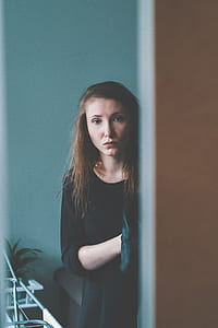 woman looking near wall during daytime thumbnail