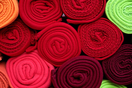 pile of assorted-color textile rolls thumbnail