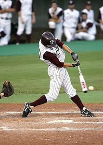 baseball player swinging bat at baseball at daytime thumbnail