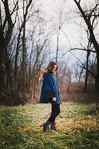 woman wearing blue and black goat thumbnail
