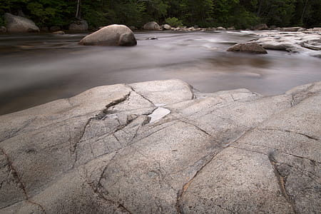 Photography of Rock Formation on Body of Water thumbnail