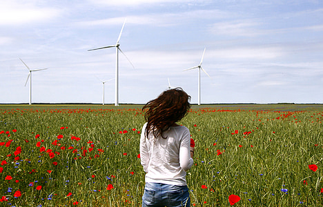 woman with white shirt on red poppy field at daytime thumbnail