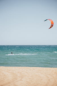 Surfboarding with surfing kite in the ocean thumbnail