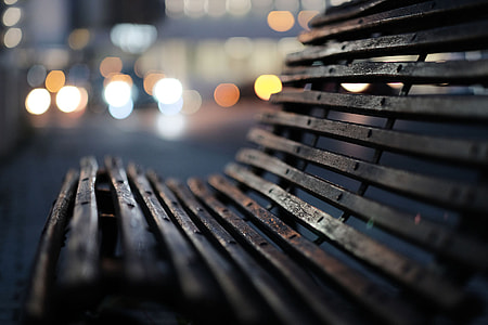 bokeh photography of brown bench thumbnail