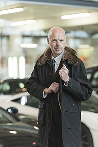 man in black parka coat thumbnail