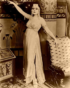 woman posing near chair thumbnail