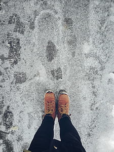 person standing on gray sand thumbnail