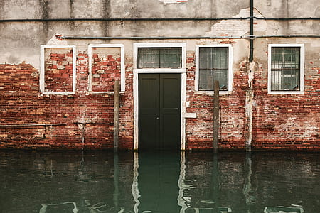 brown concrete building in water thumbnail