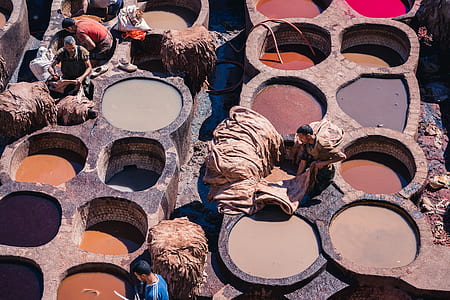 group of men fixing textiles thumbnail