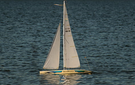 sailboat surrounded by body of water thumbnail