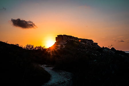 silhouette of rock during sunset thumbnail