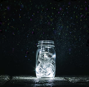 clear mason jar on black surface thumbnail