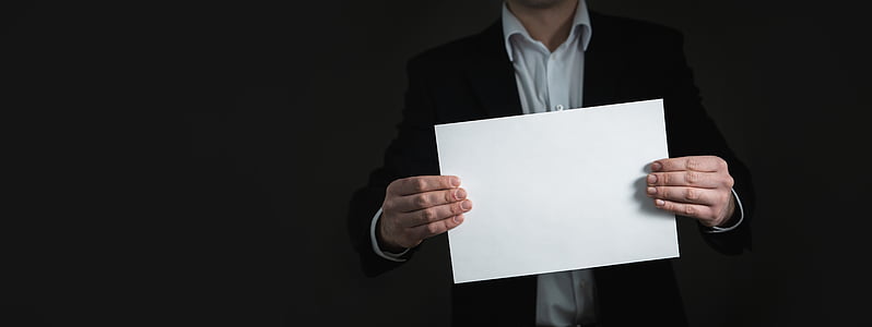 person holding white blank paper thumbnail