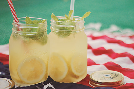 two clear glass jars filled with beverage thumbnail