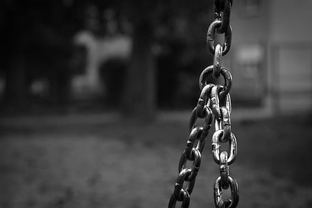 selective focus photography of black metal chain thumbnail