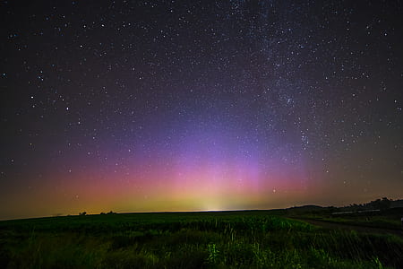 silhouette photo of green grass field during nighttime thumbnail