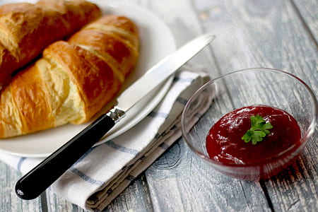 baked croissants on round white ceramic plate with red dipping sauce thumbnail