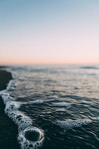 seawave with bubble on shoreline thumbnail