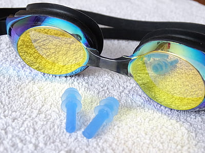 black framed goggles on white fabric surface thumbnail