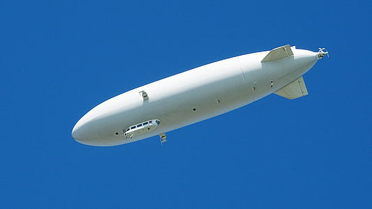 white airship at sky thumbnail