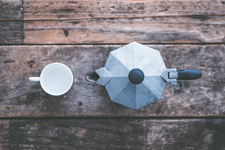 flat-lay photography of teapot and teacup on table thumbnail