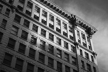white concrete building under gray sky during day time thumbnail