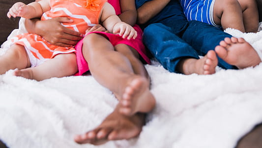 A focus on kids feet in the bed thumbnail