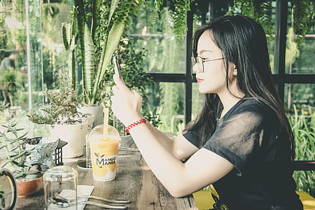 Photo of Woman Using Her Mobile Phone thumbnail