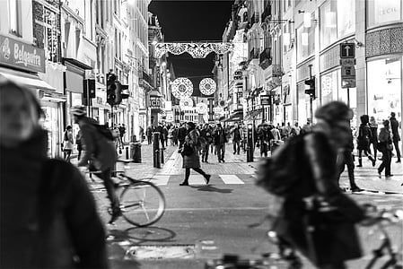 grayscale photography of people passing by thumbnail
