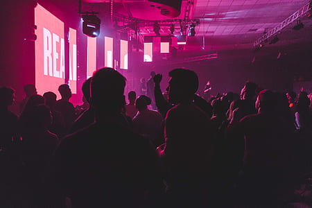 group of people standing inside building near stage thumbnail