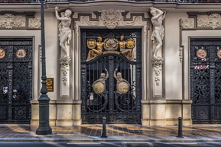 photography of closed black metal gate at daytime thumbnail