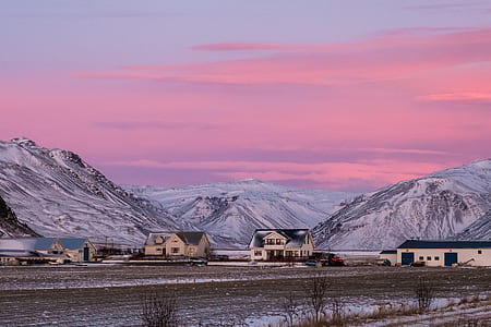 landscape photography of houses near mountain alps thumbnail
