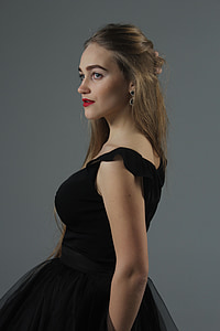 woman wears black sleeveless dress thumbnail